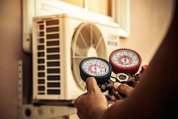 Professional Heat Pump Repair technician working in Rossville, KS